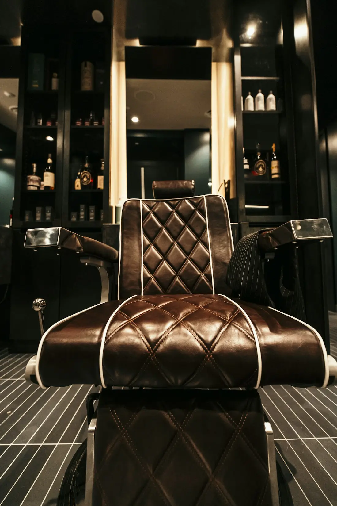 A leather barber chair under warm light