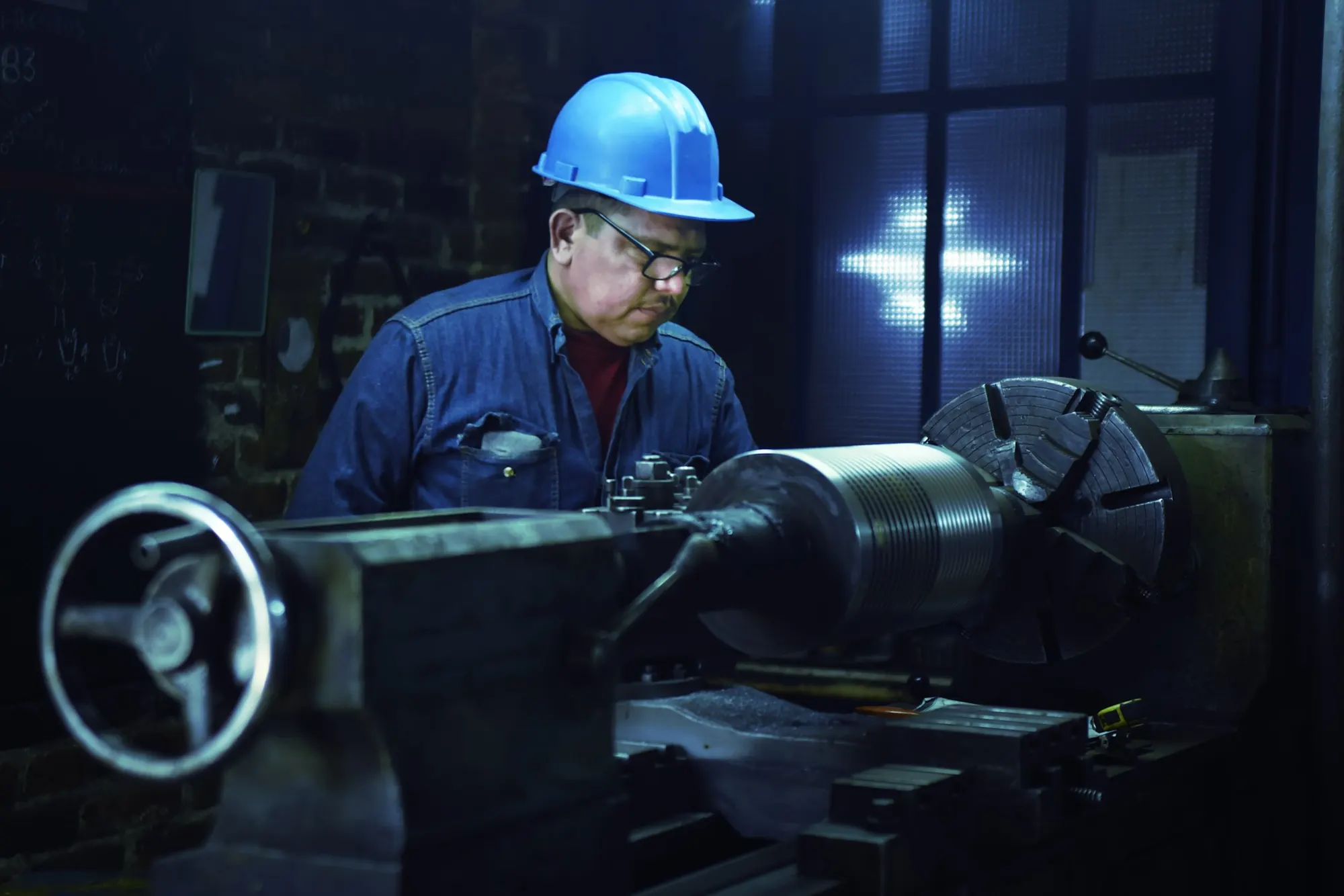 A machinist at a lathe